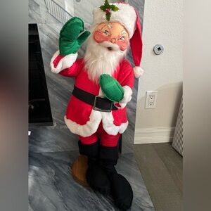 Vintage Annalee Mobilitee 30-inch Santa Claus doll on wood stand, mid-1980s.